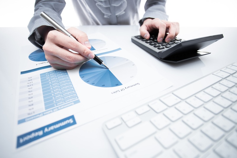 woman hand with pen and business report